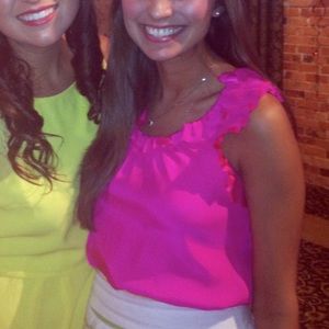 Britt Ryan orange ruffle razorback tank